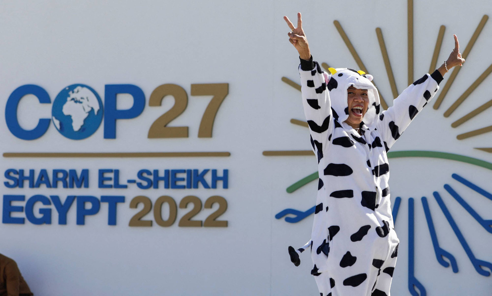 An activist demonstrates near the entrance of the Sharm El Sheikh International Convention Centre, during the COP27 climate summit opening, in Sharm el-Sheikh, Egypt, November 7, 2022.